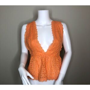 Bright orange lace eyelet patterned top. Small Summer Open back